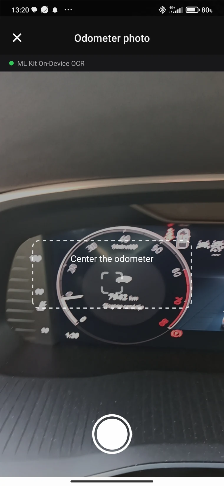 Camera pointed at the car's odometer; the app reads the number itself